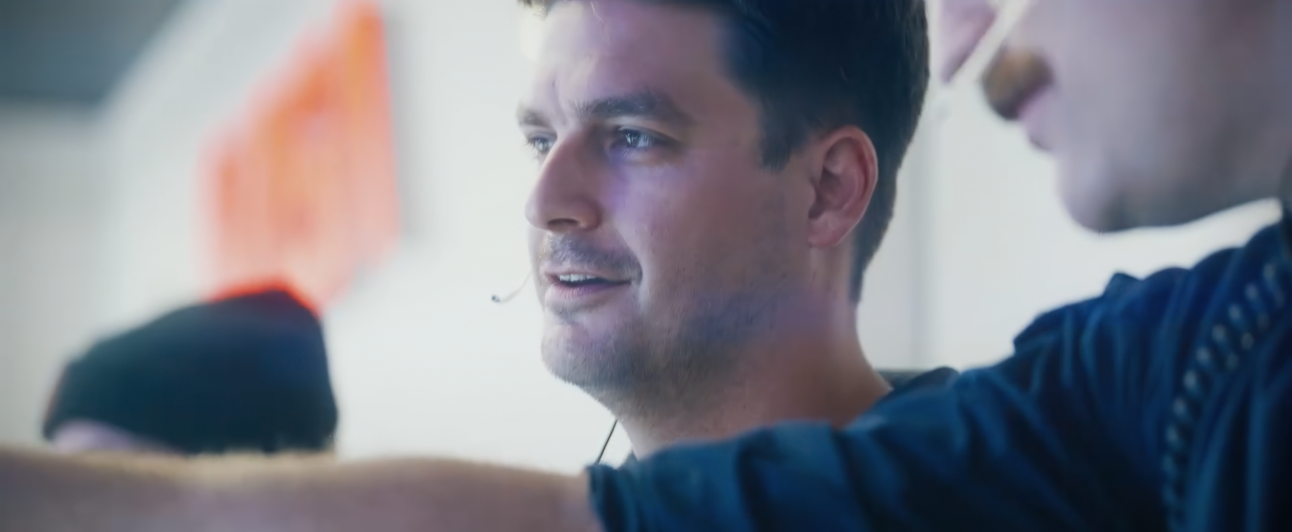 Jeb Stefan looks at a monitor while working alongside other engineers at NASA